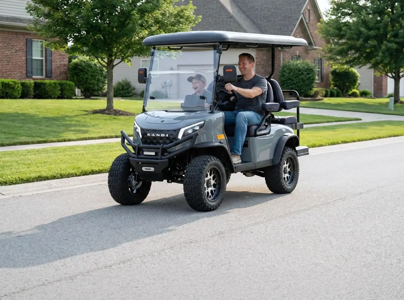 A family driving a KANDI Kruiser golf cart through a neighborhood